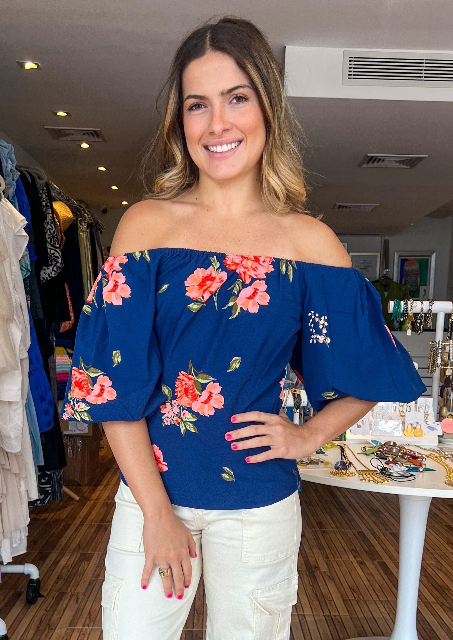 Navy blue and coral print off the shoulder balloon sleeve top.