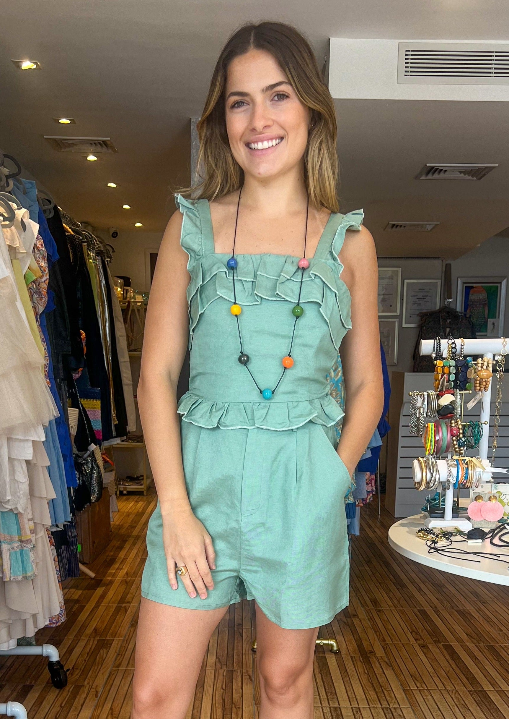 Sage green ruffle brunch outing linen set. High waisted short with pockets and elastic waistband with matching top