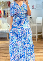 Load image into Gallery viewer, Ivory blue printed woven skirt featuring elasticized waist and tiered skirt. Ivory blue printed woven top featuring surplice neckline, short bell sleeve, side tie and smocked back waist band.
