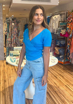 Load image into Gallery viewer, Hawaiian blue mutli ribbed wrap knit top. So comfortable and perfect for jeans.
