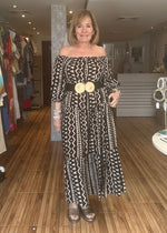 Load image into Gallery viewer, Cream and black off the shoulder maxi dress with pockets.
