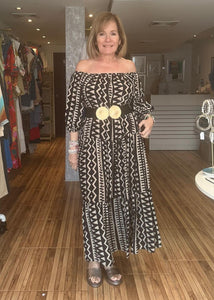 Cream and black off the shoulder maxi dress with pockets.