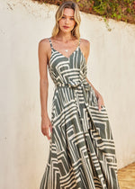 Load image into Gallery viewer, Printed maxi dress with flared hem. Dramatic a-line. Detachable self tie belt.
