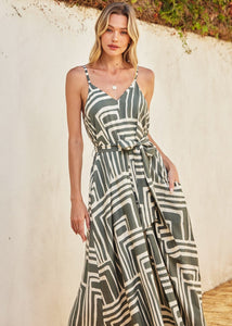 Printed maxi dress with flared hem. Dramatic a-line. Detachable self tie belt.