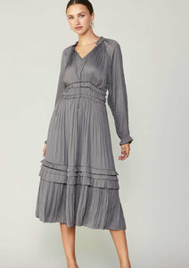 Grey long sleeve split neck long dress with ruffle detail on neck and waist and hem. 