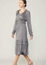Load image into Gallery viewer, Grey long sleeve split neck long dress with ruffle detail on neck and waist and hem. 
