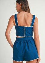 Load image into Gallery viewer, Solid sleeveless floral embroidered detail crop top with back button closure and matching shorts with front button set. Lining.
