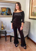 Load image into Gallery viewer, Two piece black suede set with feather details. Feather trim around the 3/4 length sleeve and around the bottom of the pants.
