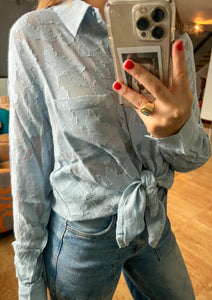 Baby blue button up sheer long sleeve blouse.